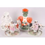 A pair of 19th century Staffordshire figures with cattle, 8 1/2" high, a cow and calf spill vase, 11