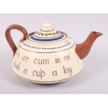 A Torquay Ware teapot, inscribed "Du ee cum in an drink a cu a tay", 14" wide (small chips to