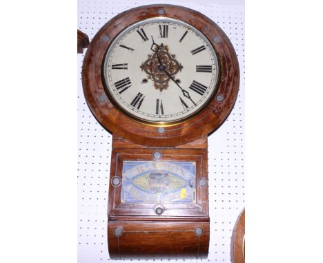 A mahogany cased wall clock with Roman numerals, painted dial and lower painted glass panel "Champion Regulator", 27" high