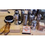 Eight retro coffee percolators, a chess set, a pair of shoe lasts, quartz clocks, bunting, and other