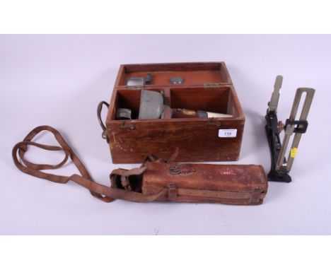 An artillery ranging sight, in leather case, and a Royal Navy type O6A hand-held oil filled compass, in fitted case