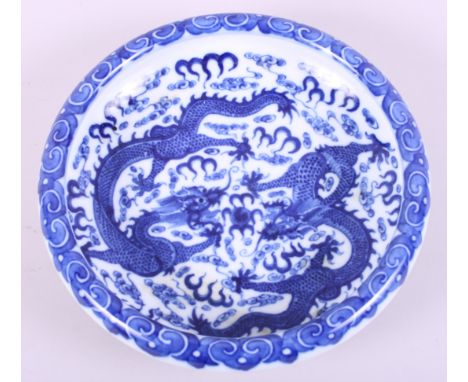 A Chinese blue and white porcelain shallow dish, decorated two dragons and clouds, seal mark to base, 7 1/2" diaCondition:App