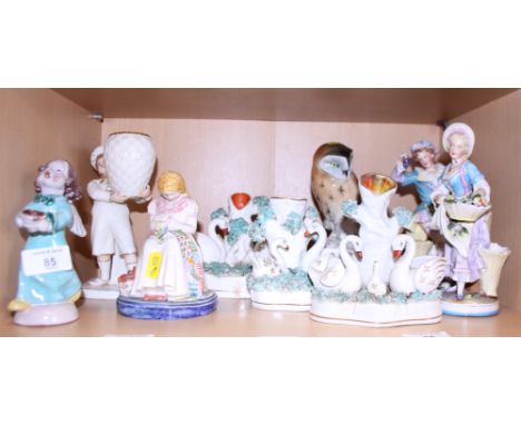 A Royal Worcester figure of a boy holding a basket, a model of an owl and other items