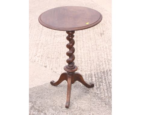 A mid 19th century walnut circular top occasional table, on barley twist tripod splay support, 18 1/2" dia