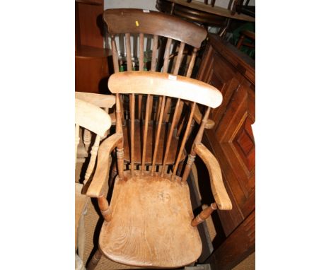 A Windsor lath back elbow chair with panel seat and a smaller, similar, elbow chair