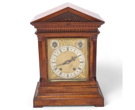 A Continental carved walnut-cased architectural 8-day mantel clock, case height 42cm, with key and pendulum 