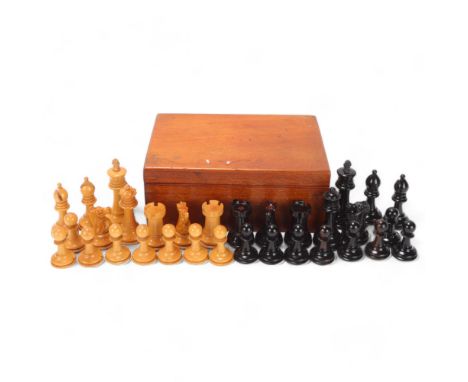 A Staunton pattern chess set, boxwood and ebonised, with weighted bases, King height 6.5cm, in mahogany box 