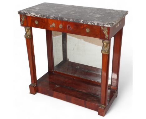 A French Empire mahogany console table, with marble top, bronze mounted Classical figure pilasters and dummy drawer frieze, w