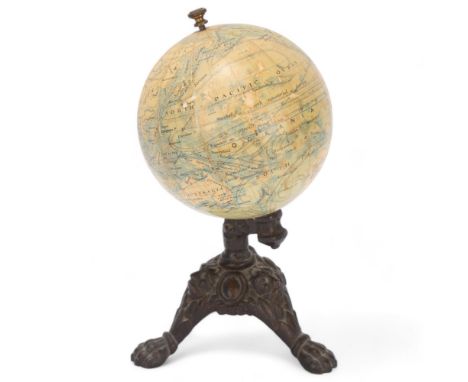 A miniature 19th century desk-top terrestrial globe, by J Lebegue of Paris, on relief cast bronze lion paw base, height 19cm,