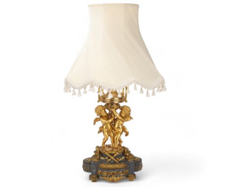 An ornate French gilt-bronze table lamp, supported by 2 cherubs, probably late 19th century, on ormolu mounted grey marble ba