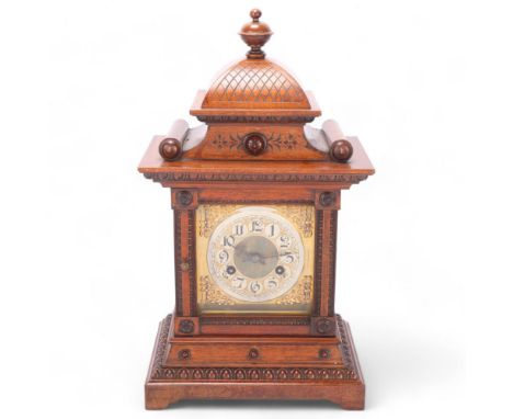 A 19th century Continental walnut-cased 8-day mantel clock, height 44cm 