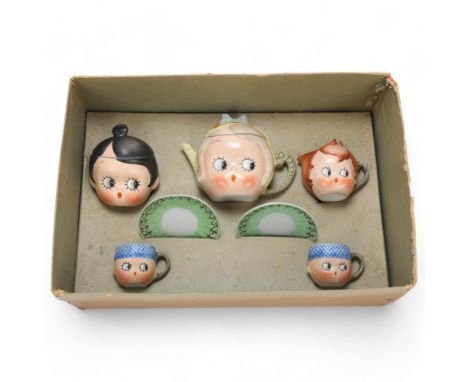 A German bisque porcelain googly eyed novelty nursery tea service, by Schafer & Vater circa 1925, teapot height 10cm, in orig