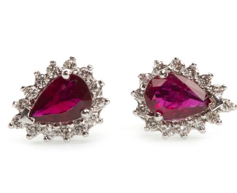 PAIR OF RUBY AND DIAMOND CLUSTER EARRINGS, each set with a pear shaped ruby within a round brilliant cut diamond halo, the di