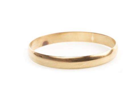 GILT METAL BANGLE, of circular form, 63mm inner diameter, 28.4g
