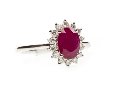 RUBY AND DIAMOND RING, the oval ruby of approximately 1.49 carats within a round brilliant cut diamond halo, the diamonds tot