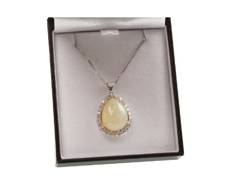 OPAL AND DIAMOND PENDANT, the cabochon opal of approximately 11.00 carats, within a diamond halo, the round brilliant cut dia