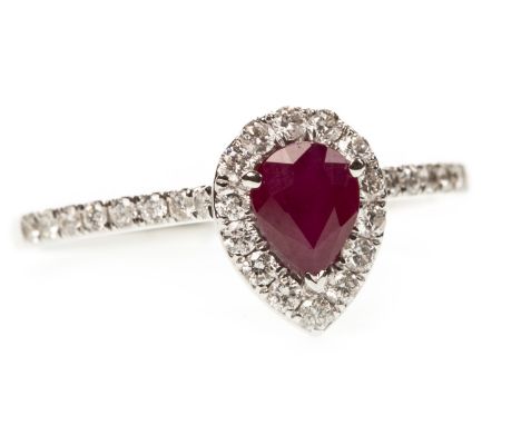 RUBY AND DIAMOND RING, the pear shaped ruby of approximately 0.47 carats, within a diamond halo, on diamond shoulders, the ro