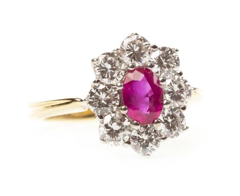 RUBY AND DIAMOND CLUSTER RING, the oval ruby of approximately 0.96 carats surrounded by round brilliant cut diamonds totallin