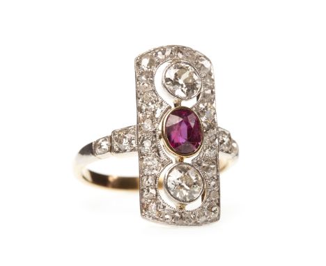 RUBY AND DIAMOND RING, the elongated bezel set with a central oval ruby flanked by two collet set round brilliant cut diamond