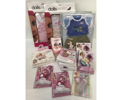 A box of new in original packing Baby Born clothes and accessories. To include food packs, coat hangers, magic bottles, pacif