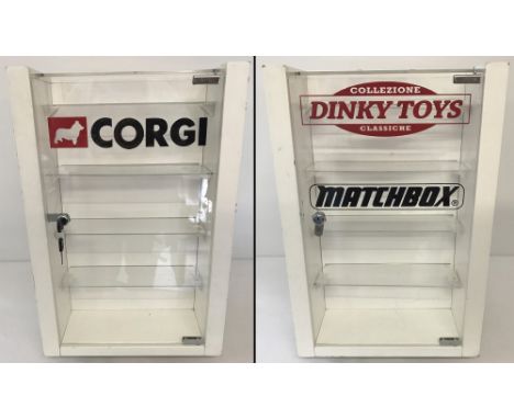 A swivel shop display cabinet with Corgi, Dinky and Matchbox advertising. Double sided with interior shelves to both sides. T