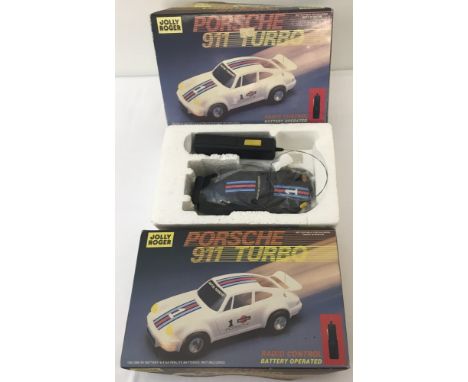 2 boxed vintage Jolly Roger Toys battery operated radio control Porsche 911 Turbo cars. In as new condition , tear to one box