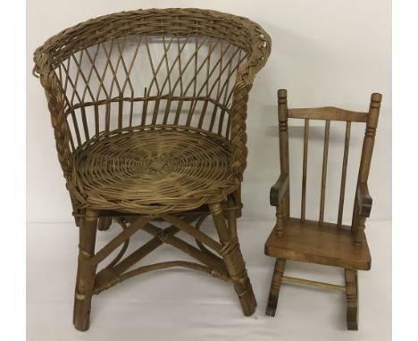 A vintage dolls wicker chair together with a dolls wooden rocking chair.