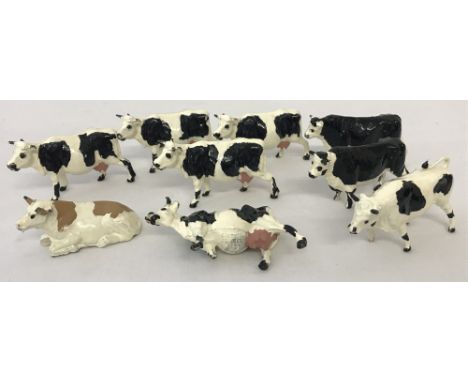 A collection of vintage metal hollow cast cow figures. To include Timpo toys and F.G.T &amp; sons, formerly part of Taylor &a