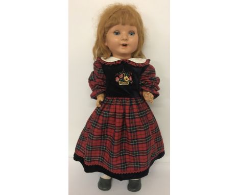A vintage ceramic talking doll with moving eyes, open mouth showing top teeth. Talking mechanism not working.