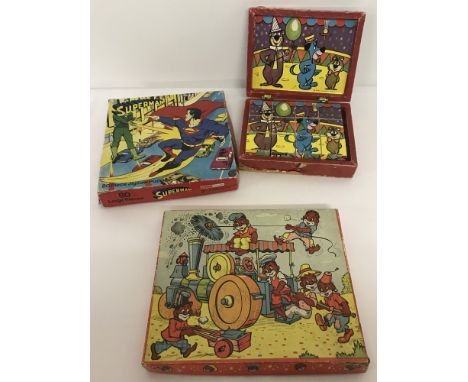 A vintage 80 piece Superman puzzle by He stair (one piece missing). Together with a vintage Yogi bear wooden block puzzle and