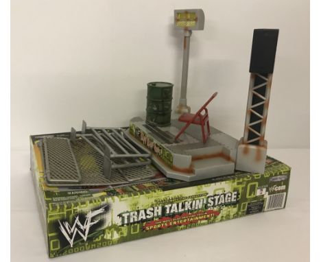 A boxed 2000 Jakks Pacific WWF wrestling Trash Talking Stage with accessories. With electronic sound, needs new batteries. In