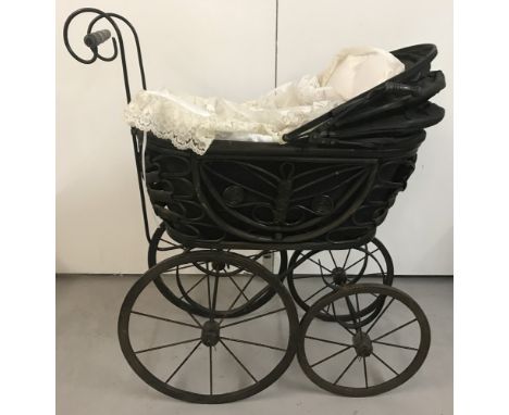 A reproduction vintage style dolls pram. Complete with lace edge pillow and covers.