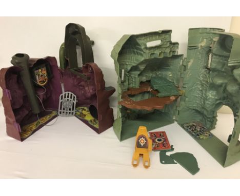 2 x 1980's Mattel, Masters of the Universe castle playsets. He-man's Castle Greyskull together with Skeletors Snake Mountain.
