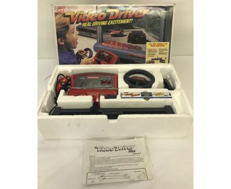 1980's boxed Sega Action GT Video Driver video game with California Chase VHS. In as new condition, box shows signs of wear b