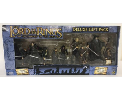 A boxed 2004 Toy Biz LOTR The Fellowship of the Ring Deluxe Gift Pack, item #81084. Box shows signs of wear but contents rema