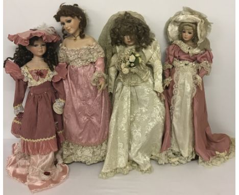 Four modern ceramic collectors dolls in period style clothing. To include Seymore Mann.
