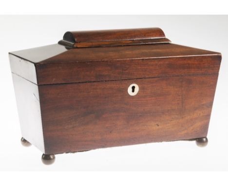 A 19TH CENTURY MAHOGANY TEA CADDY, of sarcophagus form, the interior with twin lidded compartments and aperture for a mixing 