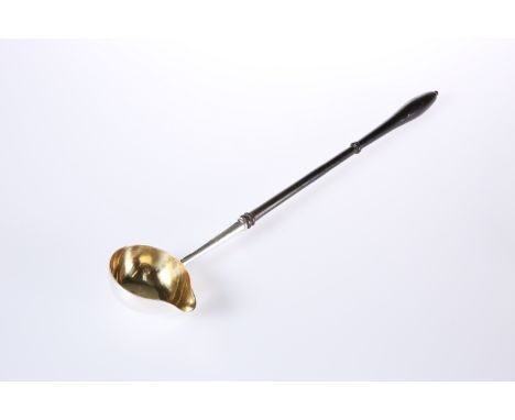 A LARGE GEORGE II SILVER TODDY LADLE, DAVID MOWDEN, LONDON 1745, the bowl with gilded interior, turned wooden handle. 39cm