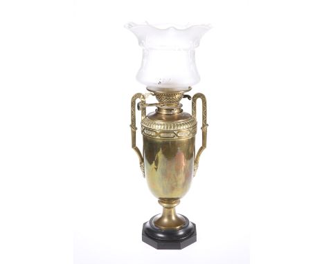 A BRASS LAMP, CIRCA 1900, the vasiform body with twin handles, Messengers Patent burner. 55cm