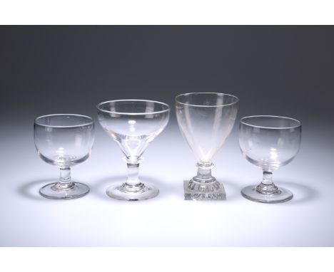 FOUR 19TH CENTURY GLASS RUMMERS, comprising a pair with plain rounded bowls, one with "lemon squeezer" foot and another with 