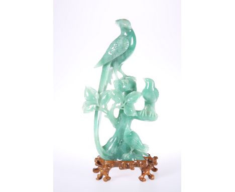 A CHINESE CARVED HARDSTONE MODEL OF LOVE BIRDS, EARLY 20TH CENTURY, the three birds carved perched on a naturalistic base, on