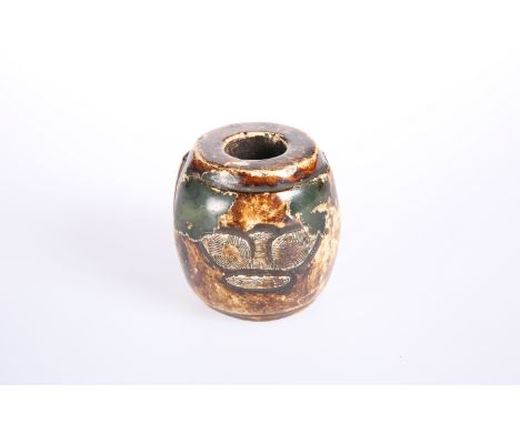 A JADE CARVING IN CHINESE ARCHAIC STYLE, of barrel form, decorated in two panels with a stylised bird. Height 6cm