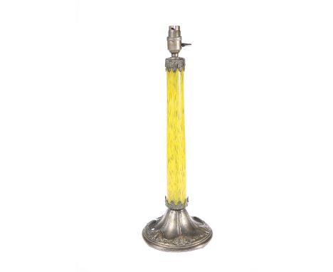 AN ART NOUVEAU METAL-MOUNTED GLASS TABLE LAMP, CIRCA 1900, with streaky yellow glass standard, the domed base embossed with s