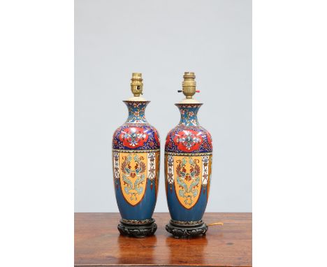 A PAIR OF JAPANESE CLOISONNE LAMP BASES, MEIJI PERIOD, with ginbari shoulders, raised on wooden stands. 40cm to top of fittin