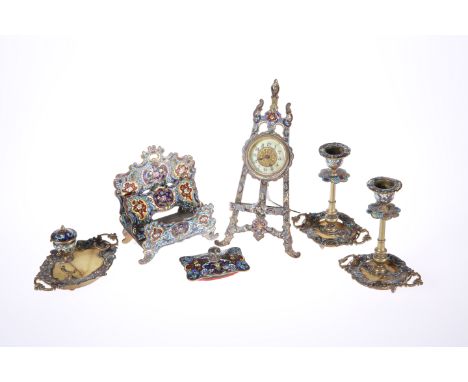 A CONTINENTAL CLOISONNE ENAMEL DESK SET c. 1900, comprising: easel clock, letter rack (a/f), inkwell and pen holder, blotter 