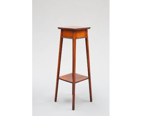 AN EDWARDIAN MAHOGANY PLANTSTAND, with carved beading to the frieze, raised on splayed square-section legs joined by a shelf 