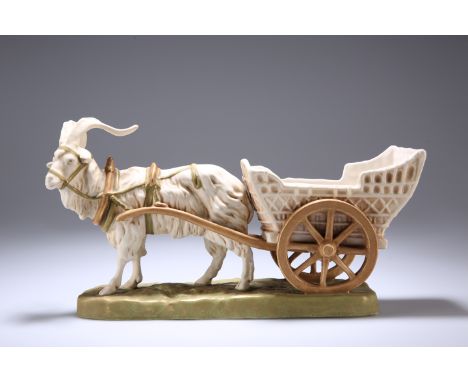 A ROYAL DUX MODEL OF A HARNESSED GOAT AND CART, modelled upon a grassy base, impressed no. 951, applied pink triangle and blu