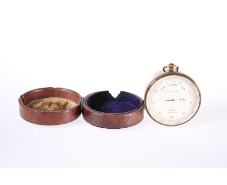 HEATH, PLYMOUTHA BRASS CASED POCKET BAROMETER, in a fitted leather case, in working order. Barometer 7cm diameterThe face is 