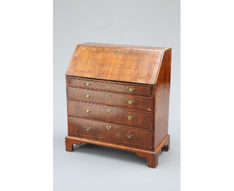 A WALNUT BUREAU, MID 18TH CENTURY, with feather-banded slope opening to reveal an interior with pigeon holes, drawers and a c