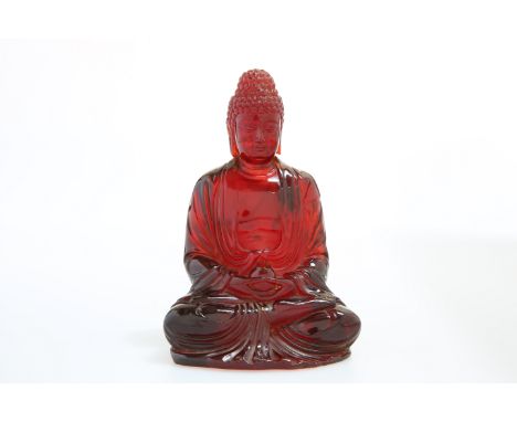A CHINESE MODEL OF A SEATED BUDDHA, POSSIBLY CHERRY AMBER. 18cm